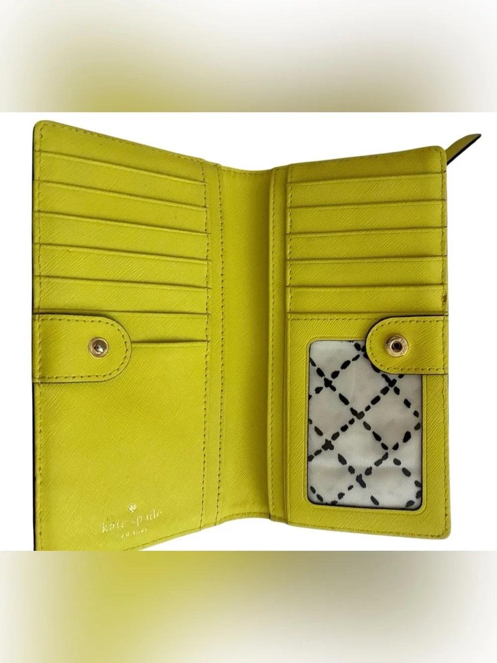 Lime green Kate Spade New York slim bifold wallet features multiple card slots
